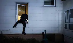 burglar-breaking-into-house-open-window-sm-300x175
